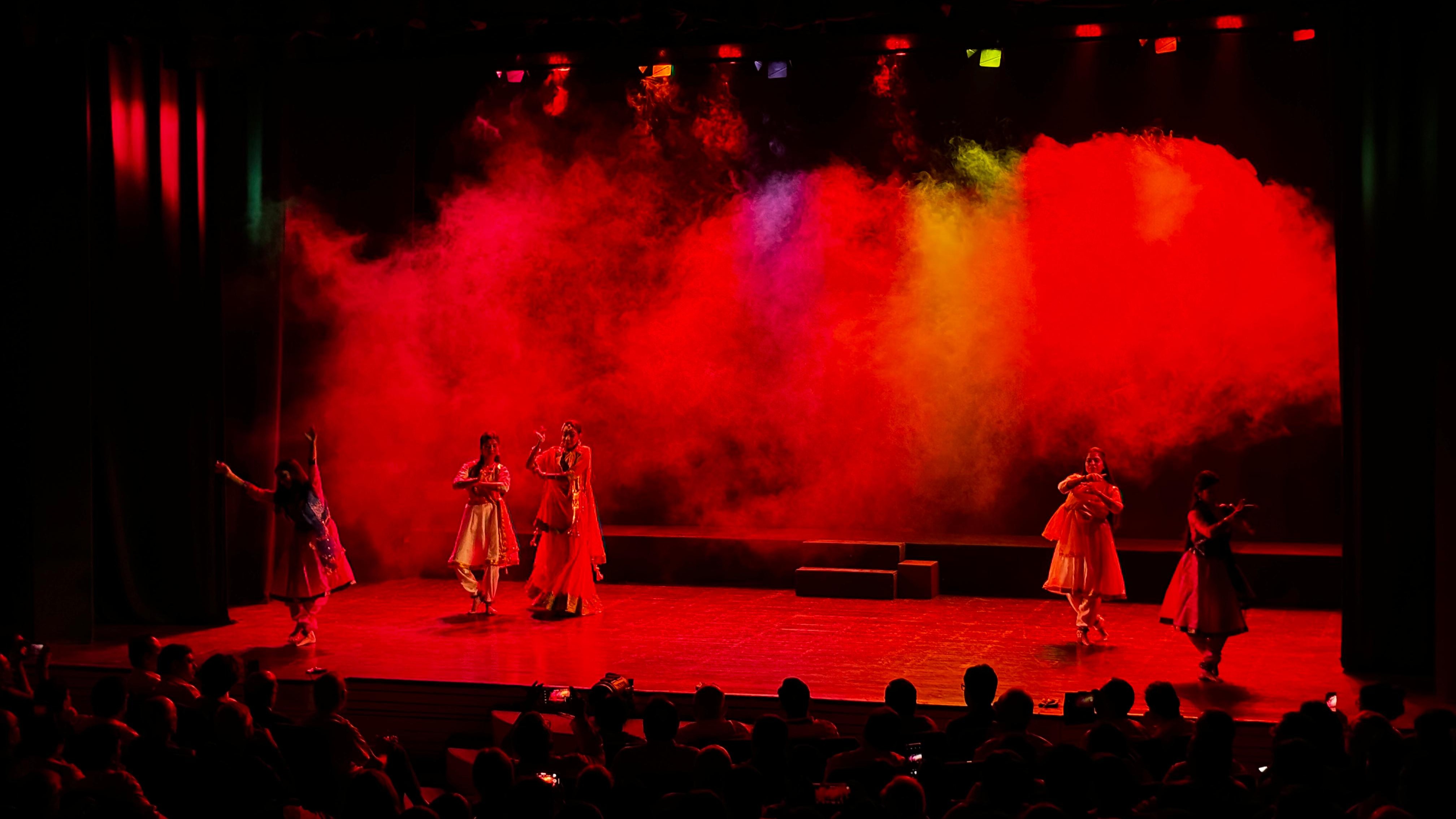 Ensemble performance under vivid red stage lighting